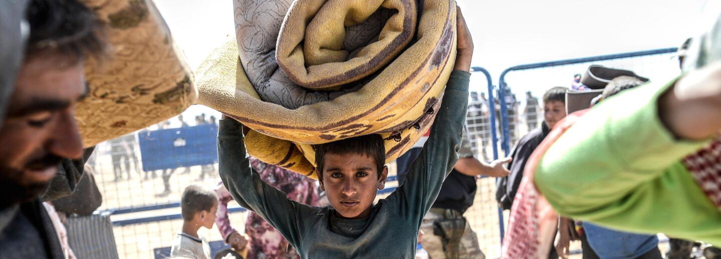 SYRIA-TURKEY-IRAQ-KURDS-CONFLICT-REFUGEES